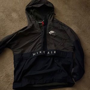 Grey and navy blue Nike windbreaker
